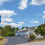 exterior building and road sign for Baymont by Wyndham Greenwood